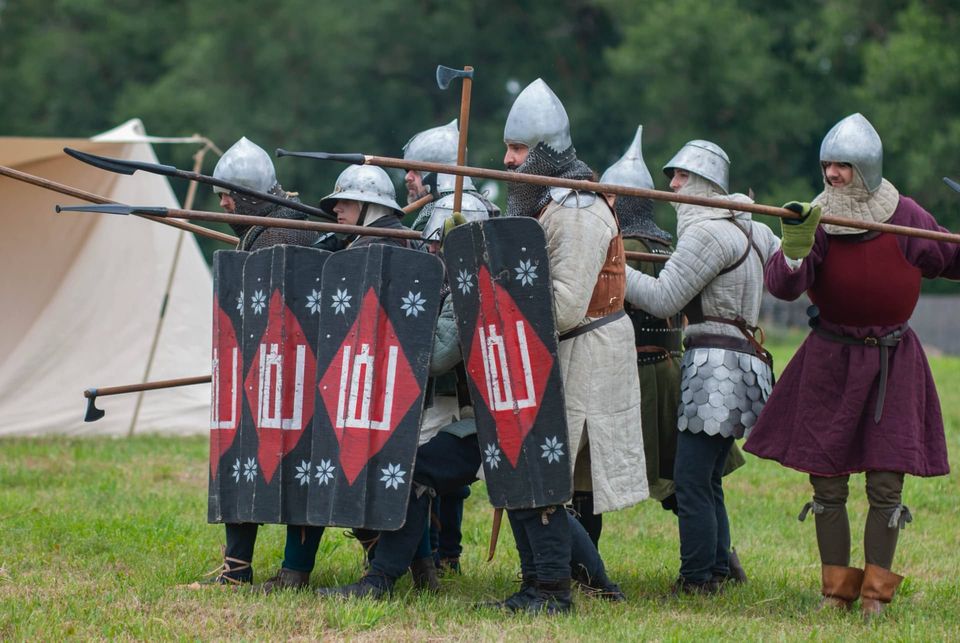 Reenactors forming a shield wall